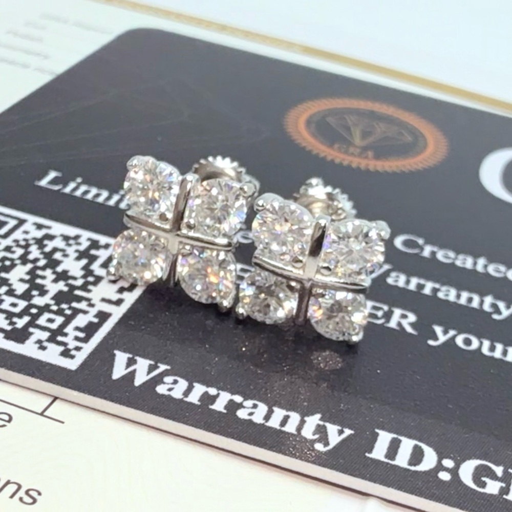 1.6ct Moissanite Cross Over Stud Earrings . Platinum plated .